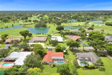 *** DISCOVER UNPARALLELED ELEGANCE NESTLED ON OVER HALF AN ACRE on Country Club of Coral Springs in Florida - for sale on GolfHomes.com, golf home, golf lot