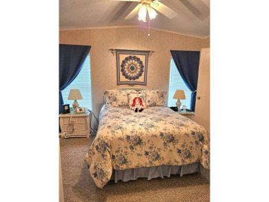 This 2 bedroom, 2 bath has approximately 1000 feet of living on Southport Springs Golf Club in Florida - for sale on GolfHomes.com, golf home, golf lot