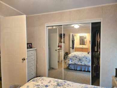This 2 bedroom, 2 bath has approximately 1000 feet of living on Southport Springs Golf Club in Florida - for sale on GolfHomes.com, golf home, golf lot