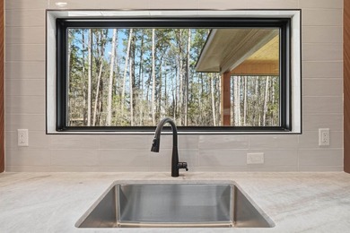 Discover the perfect blend of modern comfort, style, and relaxed on  in Arkansas - for sale on GolfHomes.com, golf home, golf lot