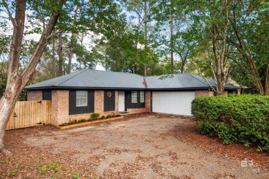 Welcome to 107 Tibidow Circle, a beautifully updated 3-bedroom on Lake Forest Yacht and Country Club in Alabama - for sale on GolfHomes.com, golf home, golf lot