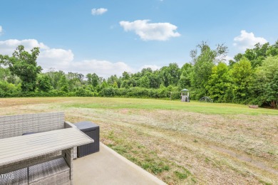 Welcome to your serene retreat nestled in a tranquil country on Reedy Creek Golf Course in North Carolina - for sale on GolfHomes.com, golf home, golf lot