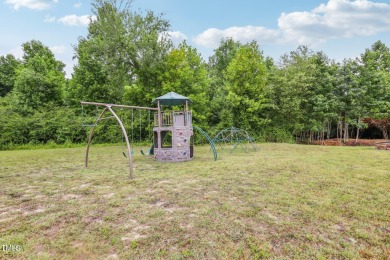 Welcome to your serene retreat nestled in a tranquil country on Reedy Creek Golf Course in North Carolina - for sale on GolfHomes.com, golf home, golf lot