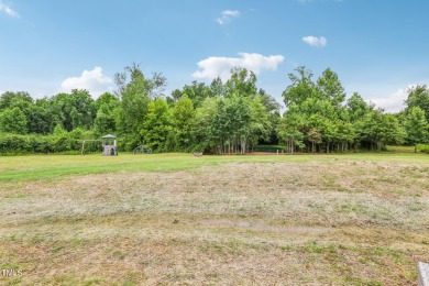 Welcome to your serene retreat nestled in a tranquil country on Reedy Creek Golf Course in North Carolina - for sale on GolfHomes.com, golf home, golf lot