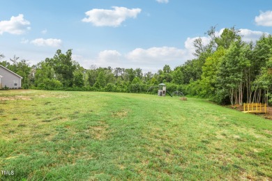 Welcome to your serene retreat nestled in a tranquil country on Reedy Creek Golf Course in North Carolina - for sale on GolfHomes.com, golf home, golf lot