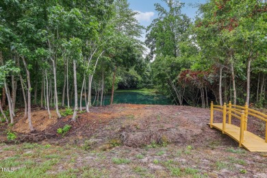 Welcome to your serene retreat nestled in a tranquil country on Reedy Creek Golf Course in North Carolina - for sale on GolfHomes.com, golf home, golf lot