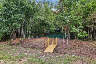 Welcome to your serene retreat nestled in a tranquil country on Reedy Creek Golf Course in North Carolina - for sale on GolfHomes.com, golf home, golf lot