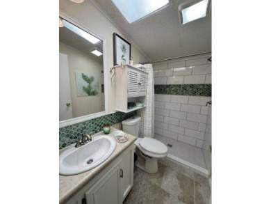 Nestled on a serene cul-de-sac overlooking the 6th Tee and lush on Four Lakes Golf Club in Florida - for sale on GolfHomes.com, golf home, golf lot