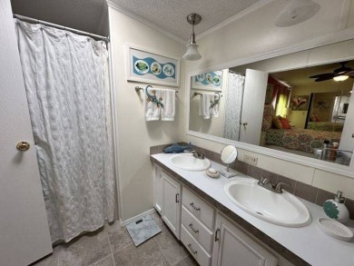 Nestled on a serene cul-de-sac overlooking the 6th Tee and lush on Four Lakes Golf Club in Florida - for sale on GolfHomes.com, golf home, golf lot