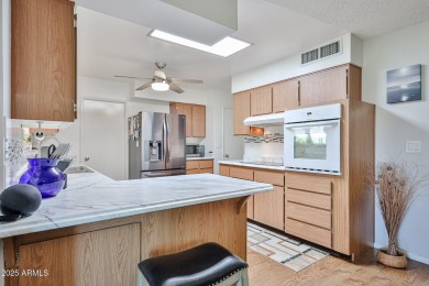 This updated home near the Sun Dial Recreation Center features a on Sun City Lakes West and East in Arizona - for sale on GolfHomes.com, golf home, golf lot