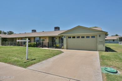 This updated home near the Sun Dial Recreation Center features a on Sun City Lakes West and East in Arizona - for sale on GolfHomes.com, golf home, golf lot