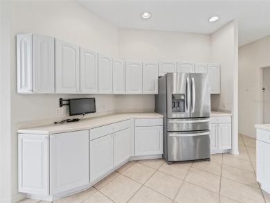 One or more photo(s) has been virtually staged. CUSTOM Magnolia on El Santiago Executive Golf Course in Florida - for sale on GolfHomes.com, golf home, golf lot