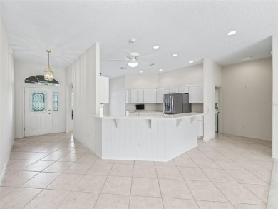 One or more photo(s) has been virtually staged. CUSTOM Magnolia on El Santiago Executive Golf Course in Florida - for sale on GolfHomes.com, golf home, golf lot