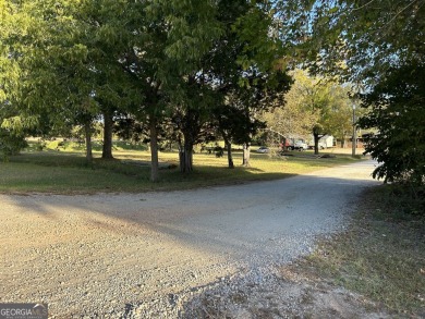 Unique opportunity with abundant possibilities! Attractive on Uncle Remus Golf Course in Georgia - for sale on GolfHomes.com, golf home, golf lot