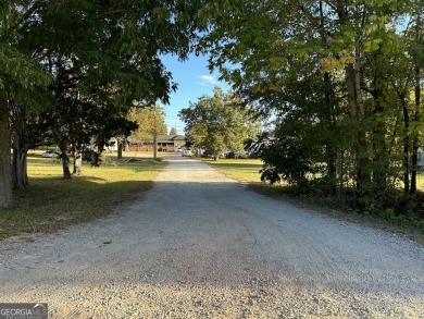 Unique opportunity with abundant possibilities! Attractive on Uncle Remus Golf Course in Georgia - for sale on GolfHomes.com, golf home, golf lot