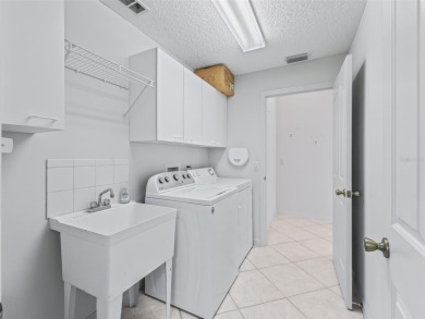 One or more photo(s) has been virtually staged. CUSTOM Magnolia on El Santiago Executive Golf Course in Florida - for sale on GolfHomes.com, golf home, golf lot