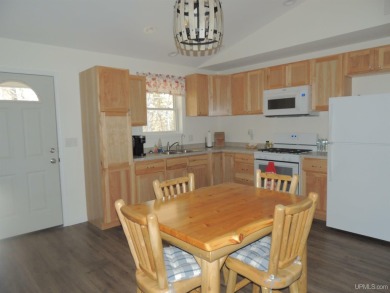 Just pack your bags and move right in to this immaculate totally on Nahma Club in Michigan - for sale on GolfHomes.com, golf home, golf lot