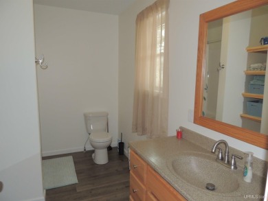 Just pack your bags and move right in to this immaculate totally on Nahma Club in Michigan - for sale on GolfHomes.com, golf home, golf lot