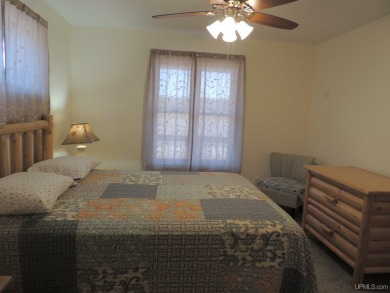 Just pack your bags and move right in to this immaculate totally on Nahma Club in Michigan - for sale on GolfHomes.com, golf home, golf lot