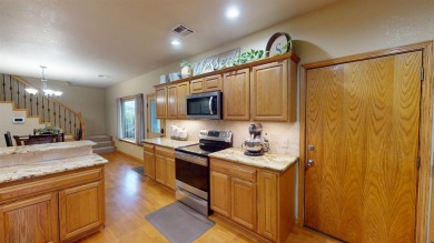 The home at 207 Redwood Drive is located near the Crystal Beach on Woodward Municipal Golf Course in Oklahoma - for sale on GolfHomes.com, golf home, golf lot