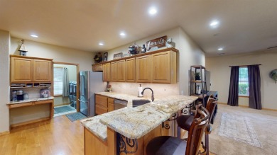 The home at 207 Redwood Drive is located near the Crystal Beach on Woodward Municipal Golf Course in Oklahoma - for sale on GolfHomes.com, golf home, golf lot