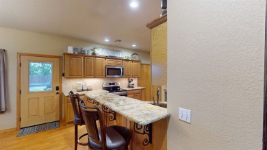 The home at 207 Redwood Drive is located near the Crystal Beach on Woodward Municipal Golf Course in Oklahoma - for sale on GolfHomes.com, golf home, golf lot
