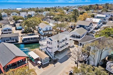 STUNNING 4 BED/4 BATH LAKEFRONT RAISED BEACH HOUSE WITH TONS OF on Prestwick Country Club in South Carolina - for sale on GolfHomes.com, golf home, golf lot