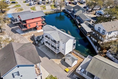 STUNNING 4 BED/4 BATH LAKEFRONT RAISED BEACH HOUSE WITH TONS OF on Prestwick Country Club in South Carolina - for sale on GolfHomes.com, golf home, golf lot