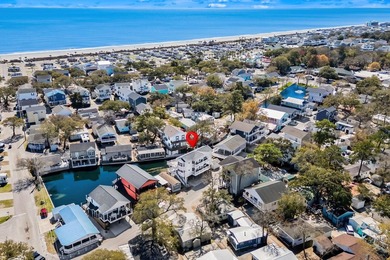 STUNNING 4 BED/4 BATH LAKEFRONT RAISED BEACH HOUSE WITH TONS OF on Prestwick Country Club in South Carolina - for sale on GolfHomes.com, golf home, golf lot