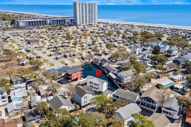 STUNNING 4 BED/4 BATH LAKEFRONT RAISED BEACH HOUSE WITH TONS OF on Prestwick Country Club in South Carolina - for sale on GolfHomes.com, golf home, golf lot