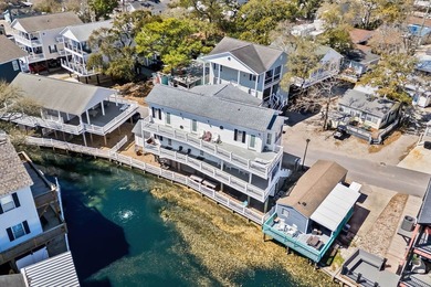 STUNNING 4 BED/4 BATH LAKEFRONT RAISED BEACH HOUSE WITH TONS OF on Prestwick Country Club in South Carolina - for sale on GolfHomes.com, golf home, golf lot