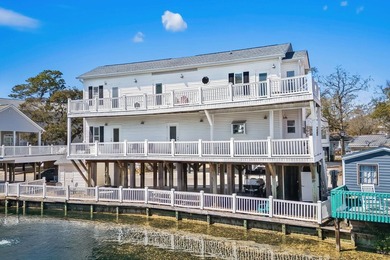 STUNNING 4 BED/4 BATH LAKEFRONT RAISED BEACH HOUSE WITH TONS OF on Prestwick Country Club in South Carolina - for sale on GolfHomes.com, golf home, golf lot