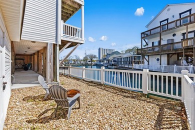 STUNNING 4 BED/4 BATH LAKEFRONT RAISED BEACH HOUSE WITH TONS OF on Prestwick Country Club in South Carolina - for sale on GolfHomes.com, golf home, golf lot