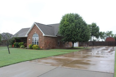 The home at 207 Redwood Drive is located near the Crystal Beach on Woodward Municipal Golf Course in Oklahoma - for sale on GolfHomes.com, golf home, golf lot