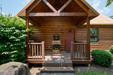 Welcome to Grin and Bear It. This amazing three bedroom, two and on Bent Creek Golf Course in Tennessee - for sale on GolfHomes.com, golf home, golf lot