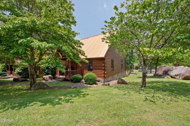 Welcome to Grin and Bear It. This amazing three bedroom, two and on Bent Creek Golf Course in Tennessee - for sale on GolfHomes.com, golf home, golf lot