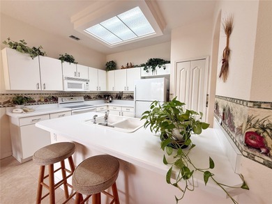 This St. Ives floor plan with screened in LANDSCAPED courtyard on Kings Ridge Golf Club in Florida - for sale on GolfHomes.com, golf home, golf lot