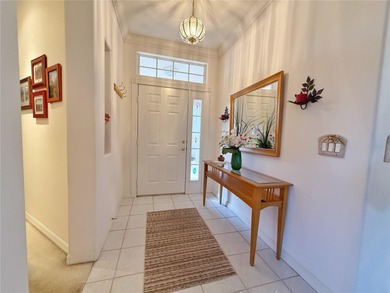 This St. Ives floor plan with screened in LANDSCAPED courtyard on Kings Ridge Golf Club in Florida - for sale on GolfHomes.com, golf home, golf lot