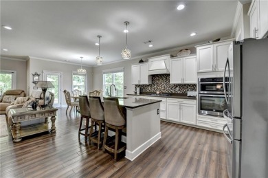 Nestled in a serene cul-de-sac, this meticulously maintained on Reunion Golf Club in Georgia - for sale on GolfHomes.com, golf home, golf lot