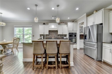 Nestled in a serene cul-de-sac, this meticulously maintained on Reunion Golf Club in Georgia - for sale on GolfHomes.com, golf home, golf lot