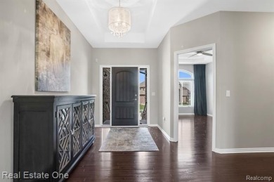 Custom built ranch with finished basement & a covered 288 sf on The Orchards Golf Club in Michigan - for sale on GolfHomes.com, golf home, golf lot
