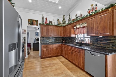 Welcome to this exceptional residence where charm, comfort, and on Woodmont Country Club in Florida - for sale on GolfHomes.com, golf home, golf lot