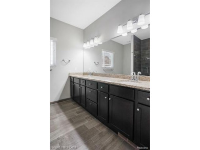 Custom built ranch with finished basement & a covered 288 sf on The Orchards Golf Club in Michigan - for sale on GolfHomes.com, golf home, golf lot