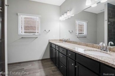 Custom built ranch with finished basement & a covered 288 sf on The Orchards Golf Club in Michigan - for sale on GolfHomes.com, golf home, golf lot