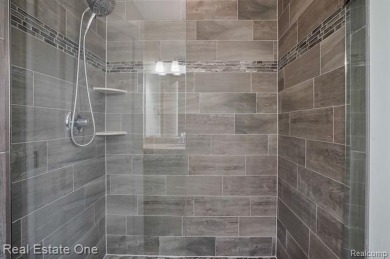 Custom built ranch with finished basement & a covered 288 sf on The Orchards Golf Club in Michigan - for sale on GolfHomes.com, golf home, golf lot