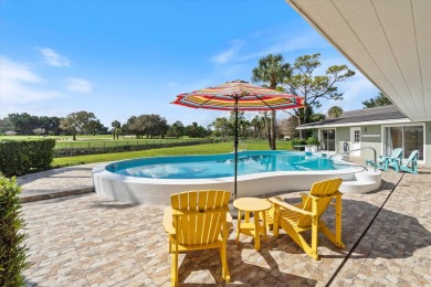 This charming 5-bedroom home offers a perfect blend of comfort on Atlantis Golf Club in Florida - for sale on GolfHomes.com, golf home, golf lot