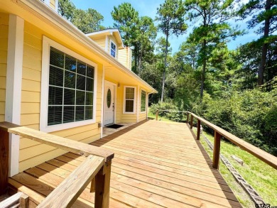 Sit on the front porch of this spacious, charming house and on Holly Lake Ranch Golf Club in Texas - for sale on GolfHomes.com, golf home, golf lot