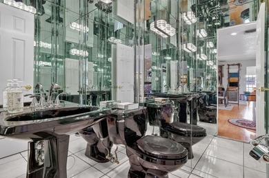 Welcome to this exceptional residence where charm, comfort, and on Woodmont Country Club in Florida - for sale on GolfHomes.com, golf home, golf lot