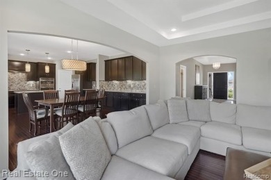 Custom built ranch with finished basement & a covered 288 sf on The Orchards Golf Club in Michigan - for sale on GolfHomes.com, golf home, golf lot