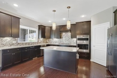 Custom built ranch with finished basement & a covered 288 sf on The Orchards Golf Club in Michigan - for sale on GolfHomes.com, golf home, golf lot
